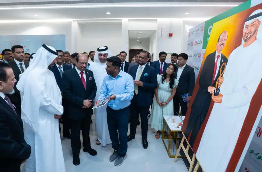 Artist Sarans Guruvayoor Presents Portrait to M.A. Yusuff Ali