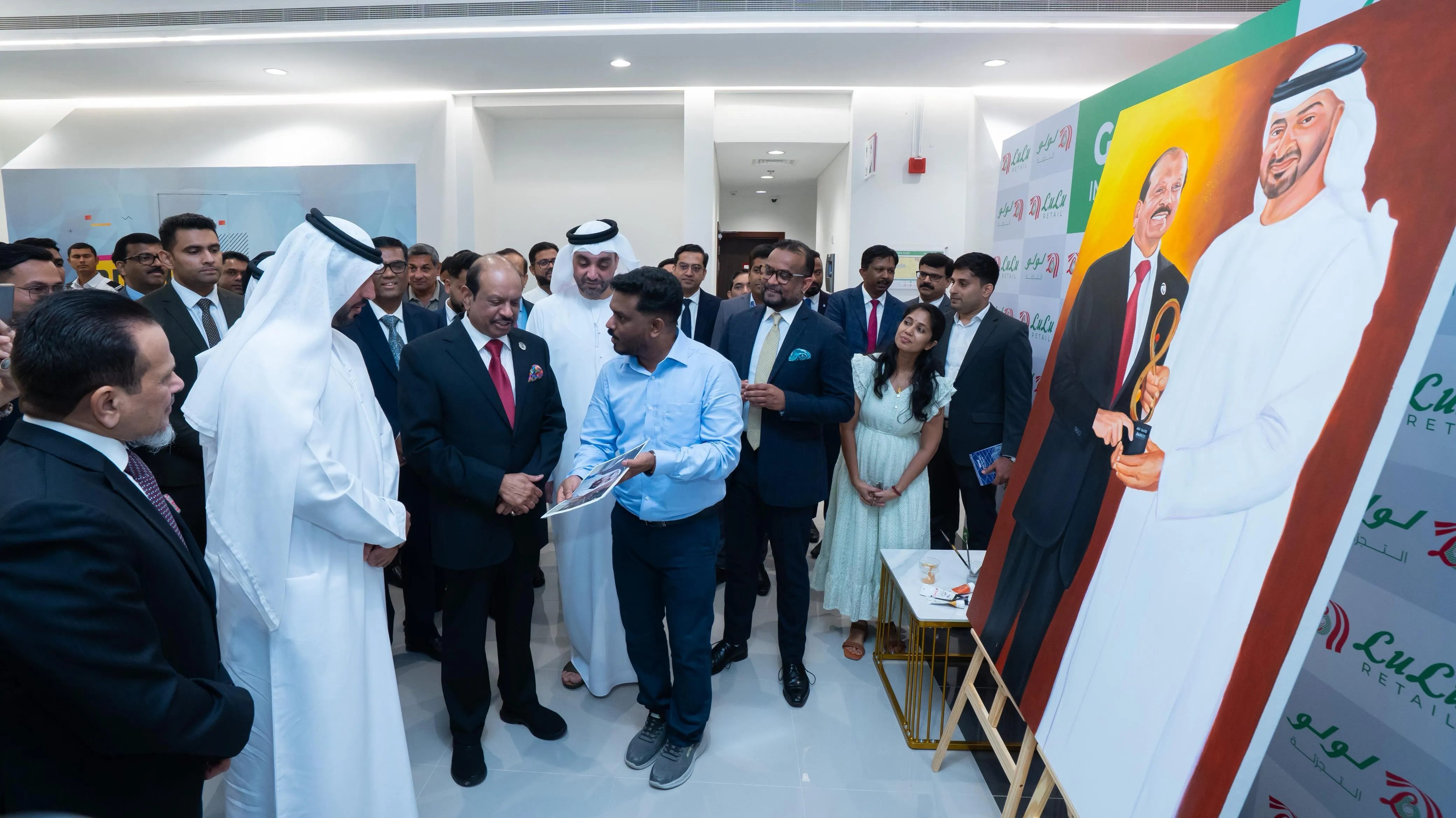 Artist Sarans Guruvayoor Presents Portrait to M.A. Yusuff Ali